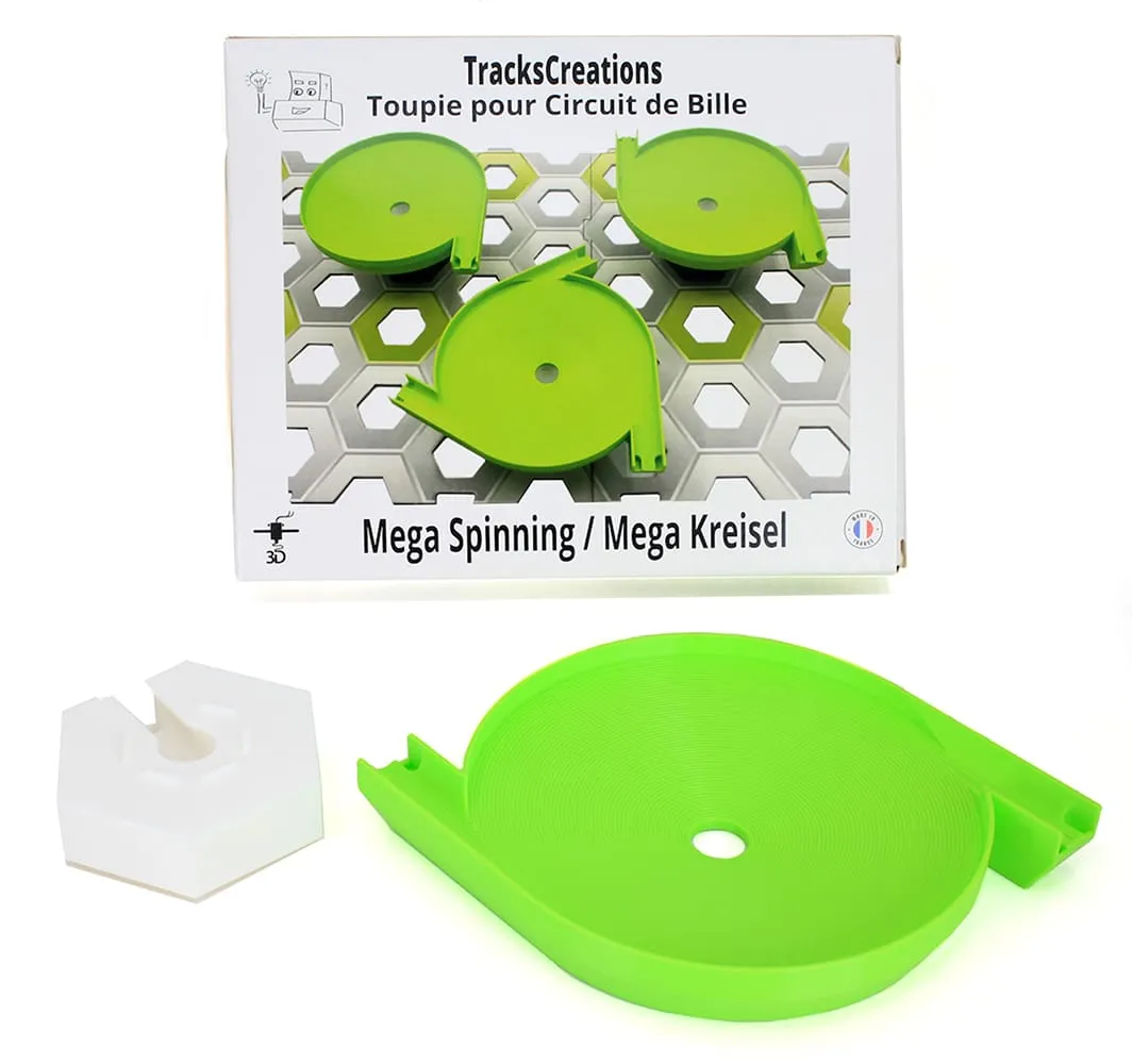 Méga toupie double entrée verte et son support blanc devant la boîte TracksCreations
