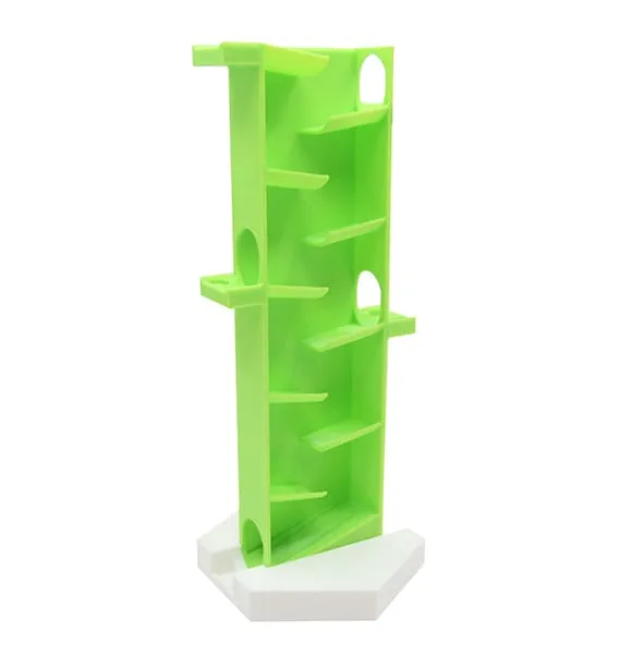 Zigzag vertical vert sur son support blanc, vue de côté