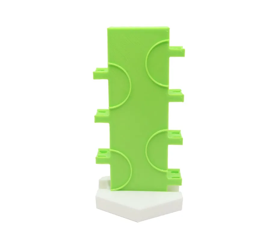 Demi-tour vertical vert sur son support blanc, vue de face